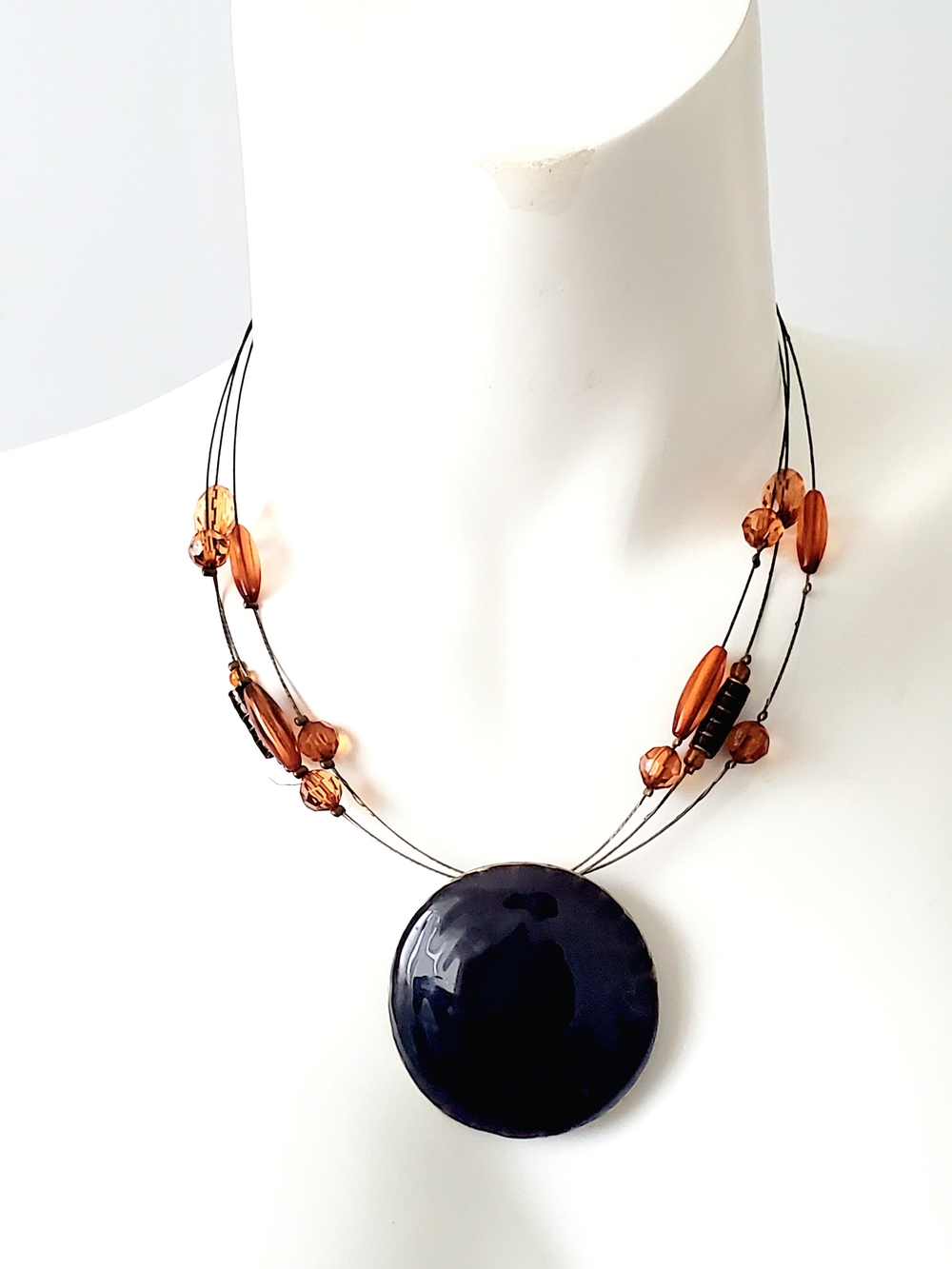 Black Disc Pendant Necklace with Amber Bead Accents
